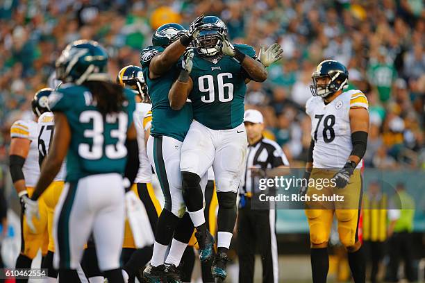 Bennie Logan of the Philadelphia Eagles celebrates sacking quarterback Ben Roethlisberger of the Pittsburgh Steelers with teammate Connor Barwin in...