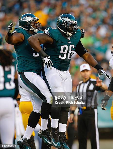 Bennie Logan of the Philadelphia Eagles celebrates sacking quarterback Ben Roethlisberger of the Pittsburgh Steelers with teammate Connor Barwin in...