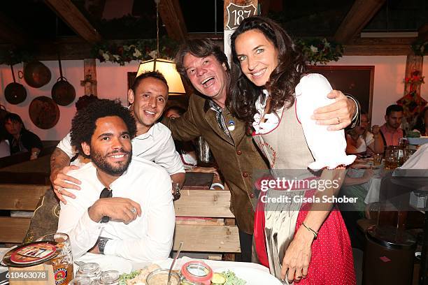 Model Thiago Santos , FC Bayern soccer player Rafinha , Michael Kaefer and his wife Clarissa Kaefer during the Oktoberfest at Kaeferschaenke,...