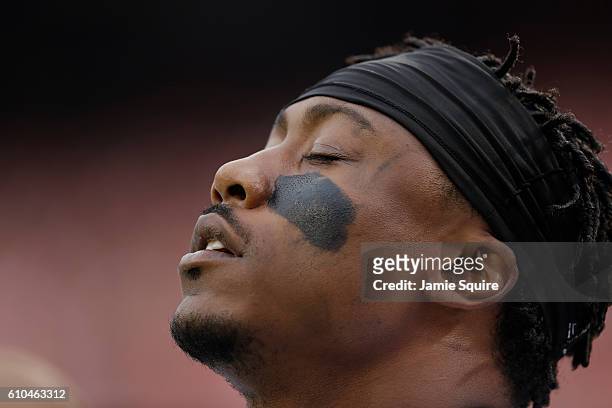 Wide receiver Brandon Marshall of the New York Jets closes his eyes during the national anthem before the game against the Kansas City Chiefs at...