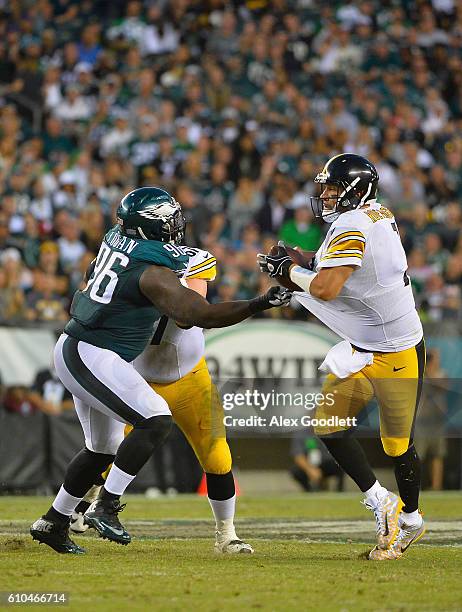 Quarterback Ben Roethlisberger of the Pittsburgh Steelers attempts escape the grasp of Bennie Logan of the Philadelphia Eagles in the fourth quarter...