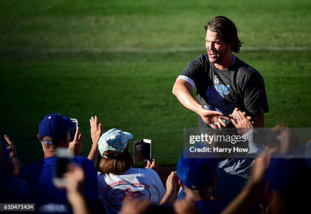 Clayton Kershaw of the Los Angeles Dodgers celebrates a 4-3 win over the Colorado Rockies to clinch the National League West Divisoin at Dodger...