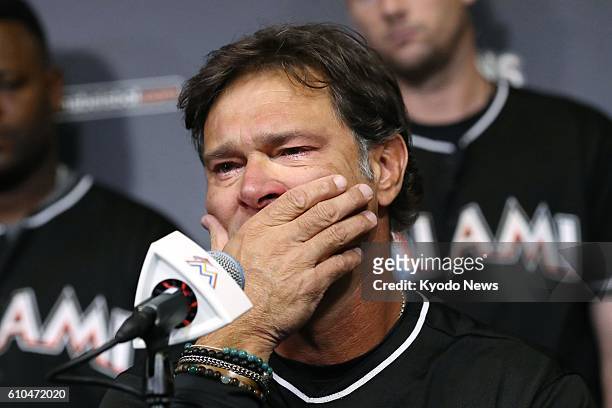 Miami Marlins manager Don Mattingly covers his mouth in emotion during a press conference at Marlins Park on Sept. 25 after ace pitcher Jose...