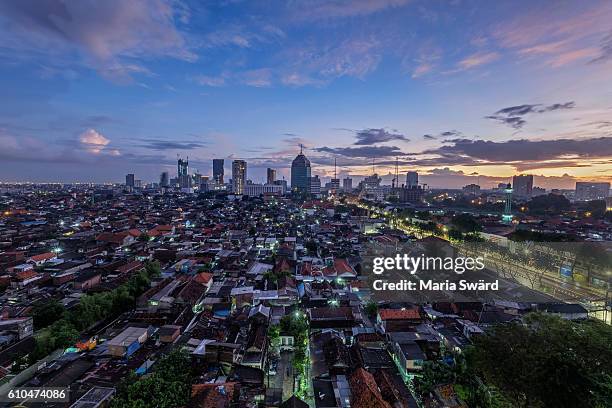 surabaya - skyline at blue hour/sunrise - surabaya stock pictures, royalty-free photos & images