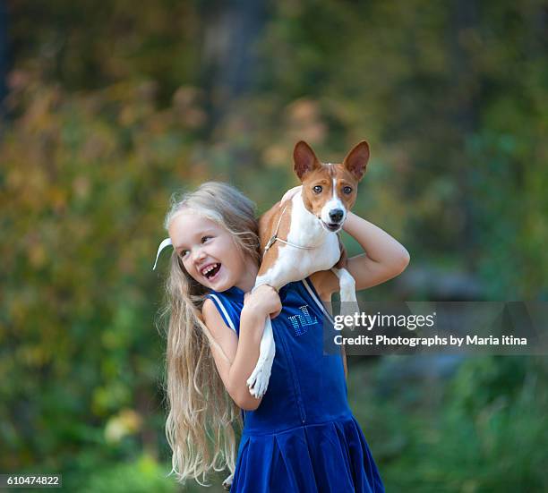 happy girl with her dog - basenji ストックフォトと画像