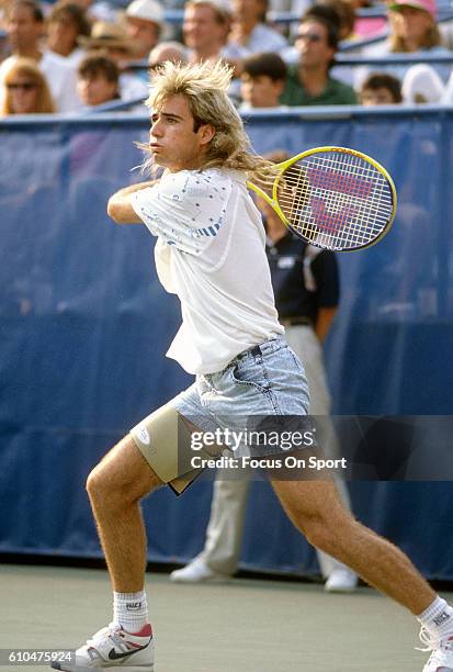 Andre Agassi of the United States return a shot during the Men's 1989 US Open Tennis Championships circa 1989 at the USTA Tennis Center in the Queens...