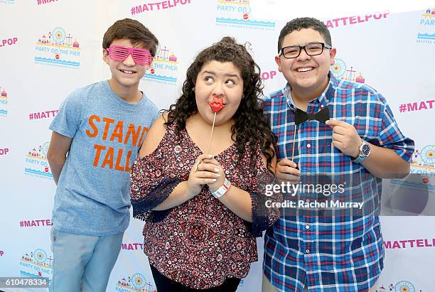 Actors Forrest Wheeler, Raini Rodriguez, and Rico Rodriguez pose at the Autograph Booth during the 17th Annual Mattel Party on the Pier on September...