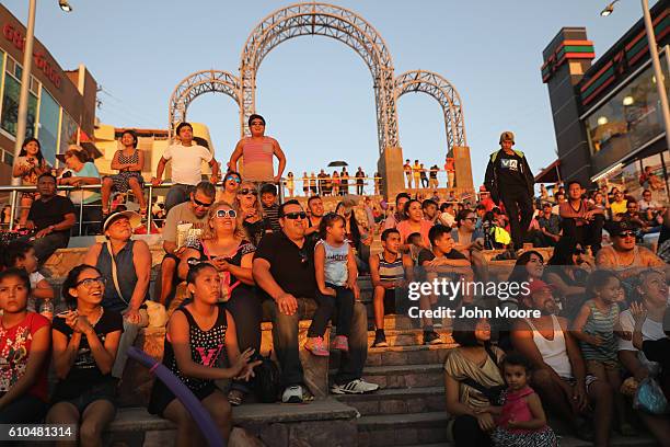 Mexicans enjoy a late afternoon near the U.S.-Mexico border fence which ends in the Pacific Ocean on September 25, 2016 in Tijuana, Mexico....