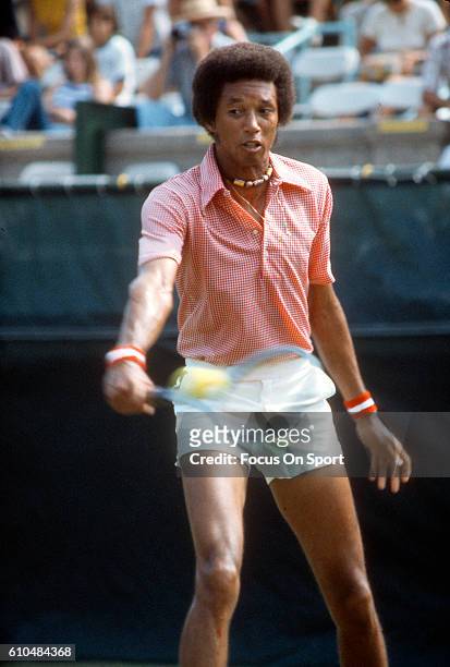 Arthur Ashe of the United States returns a shot during the Men's 1975 US Open Tennis Championships circa 1975 at Forest Hills West Side Tennis Club...