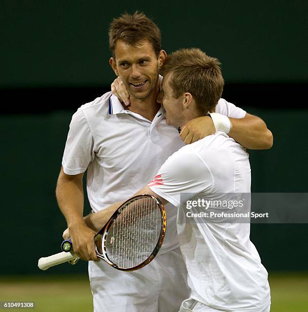 Jonathan Marray of Great Britain and Frederik Nielsen of Denmark celebrate match point during their Gentlemans Doubles final against Robert Lindstedt...