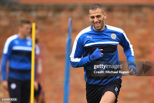 Islam Slimani of Leicester City warms up during a Leicester City training session ahead of their Champions League match against FC Porto at Belvoir...