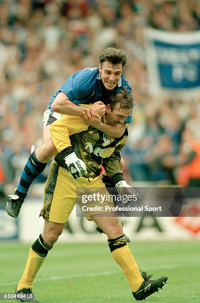 David Unsworth and Neville Southall of Everton celebrate victory in the FA Cup Final between Everton and Manchester United at Wembley Stadium in...