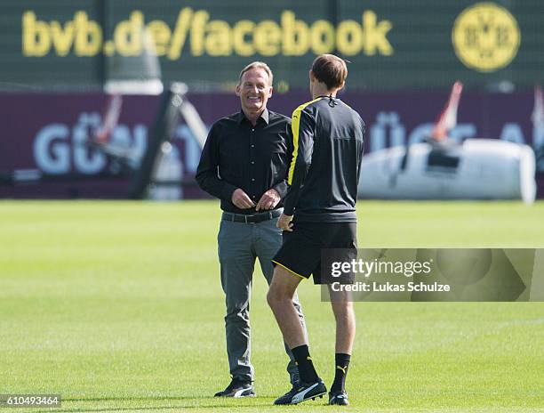 Hans-Joachim Watzke of Dortmund and Head Coach Thomas Tuchel of Dortmund are seen during a training session at Dortmund Brackel Training Ground on...