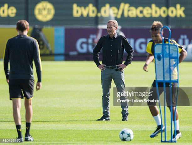 Hans-Joachim Watzke of Dortmund and Head Coach Thomas Tuchel of Dortmund are seen during a training session at Dortmund Brackel Training Ground on...