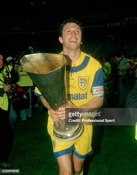 Parma captain Lorenzo Minotti holding the trophy after the UEFA Cup Final 2nd Leg between Juventus and Parma at the San Siro Stadium in Milan, 17th...