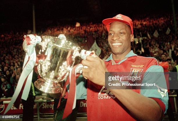 Aston Villa defender Ugo Ehiogu holding the trophy after their victory over Leeds United in the Coca Cola League Cup Final at Wembley stadium in...