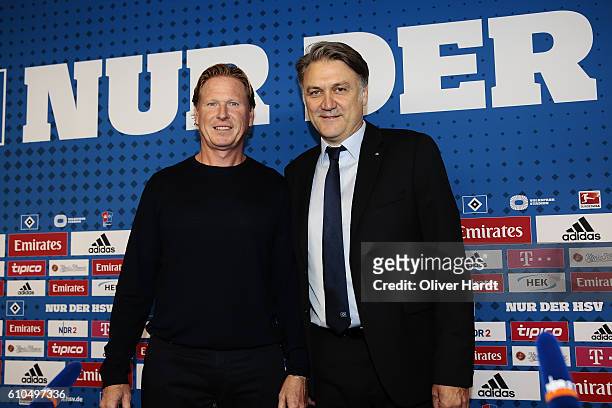 New Head Coach Markus Gisdol and CEO Dietmar Beiersdorfer of Hamburger Sport Verein poses during the press conference at Volksparkstadion on...