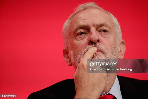 Labour Leader Jeremy Corbyn listens as Shadow Chancellor John McDonnell delivers his keynote speech to the Labour Party Conference on September 26,...