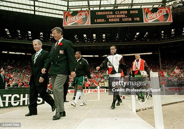 Manchester United and Liverpool are lead out by their managers, Alex Ferguson and Roy Evans prior to the FA Cup Final between Manchester United and...