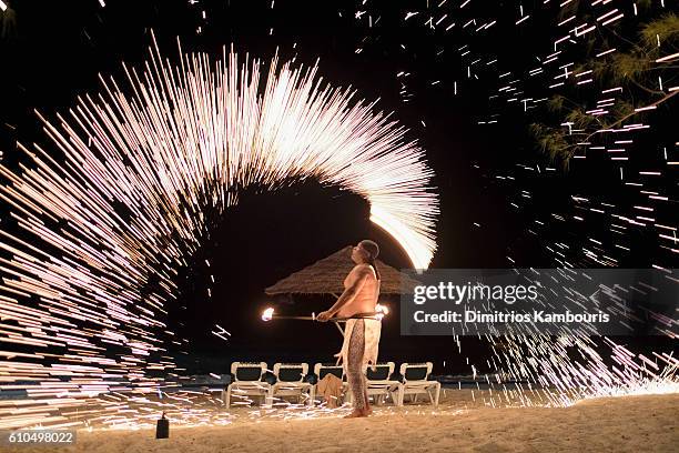 Fire dancer performs during CMT Story Behind The Songs LIV+ weekend at Beaches Turks & Caicos Resort Villages & Spa on September 25, 2016 in...