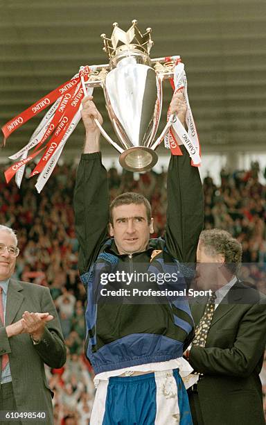 Eric Cantona of Manchester United holding the premiership trophy after winning the 1995/96 title after the FA Carling Premiership match against...