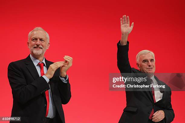 Labour Leader Jeremy Corbyn applauds after Shadow Chancellor John McDonnell delivered his keynote speech to the Labour Party Conference on September...