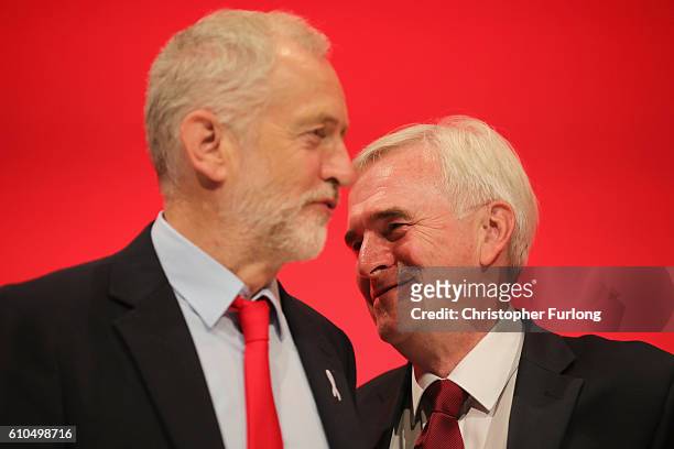 Labour Leader Jeremy Corbyn talks with Shadow Chancellor John McDonnell after the Shadow Chancellor delivered his keynote speech to the Labour Party...