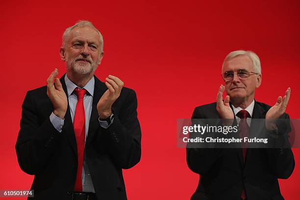 Labour Leader Jeremy Corbyn applauds after Shadow Chancellor John McDonnell delivered his keynote speech to the Labour Party Conference on September...