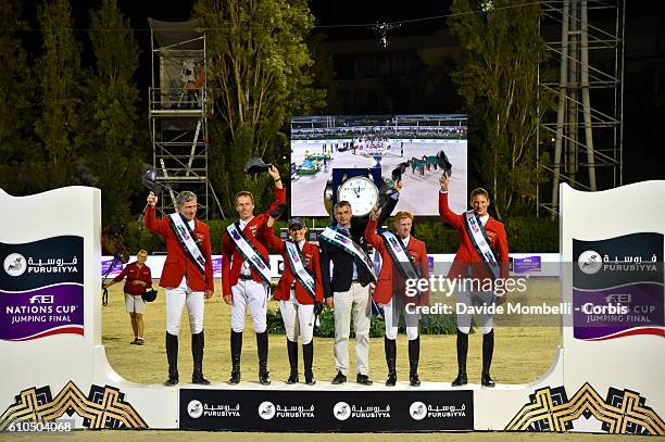 Ludger Beerbaum, Christian Ahlmann, Janne Friederike, chef d'Equipe Otto Becker, Marcus Ehning, Danial Deusser of Germany celebrate victory during...