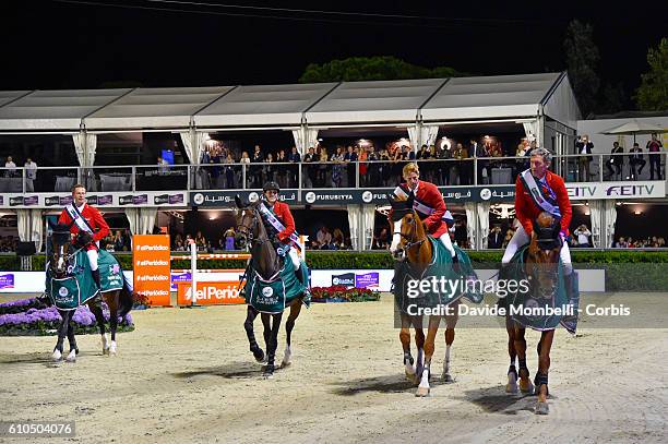 The Germany team comprising of Christian Ahlmann riding Taloubet Z, Janne Friederike Meyer riding Goja 27, Marcus Ehning riding Pret A Tout and...