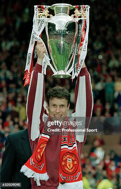 Ronny Johnsen of Manchester United holding the FA Carling Premier League Championship Trophy after the match against West Ham United at Old Trafford...