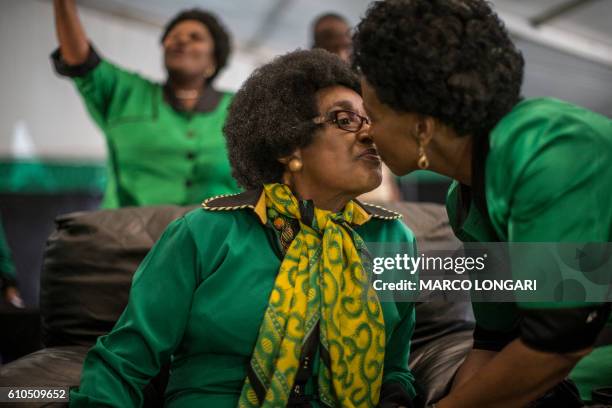 Africa National Congress stalwart Winnie Madikizela Mandela greets South Africa Minister of Foreign Affairs Maite Nkoane-Mashabane as supporters...