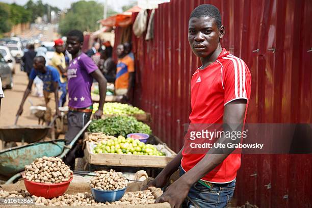 Niamey, Niger A young African is selling peanuts on the market in Niamey on August 10, 2016 in Niamey, Niger.