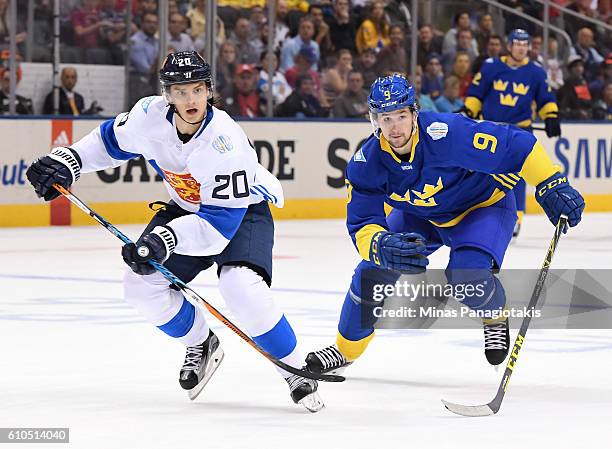 Sebastian Aho of Team Finland and Filip Forsberg of Team Sweden charge up ice/ during the World Cup of Hockey 2016 at Air Canada Centre on September...