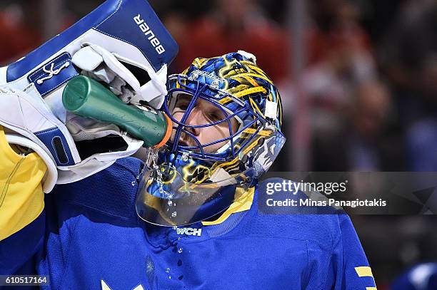 Henrik Lundqvist of Team Sweden takes a drink against Team Finland during the World Cup of Hockey 2016 at Air Canada Centre on September 20, 2016 in...