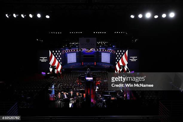 Network television news teams broadcast from the site of Monday night's presidential debate between Democratic presidential candidate Hillary Clinton...