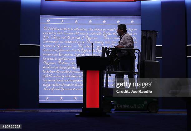 Worker readies the stage for tonight, where Democratic presidential candidate Hillary Clinton and Republican presidential candidate Donald Trump will...