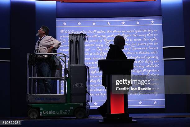 Workers ready the stage for tonight, where Democratic presidential candidate Hillary Clinton and Republican presidential candidate Donald Trump will...