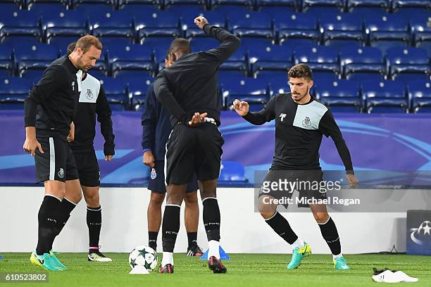 Laurent Depoitre of FC Porto and Ruben Neves of FC Porto warm up with team mates during a FC Porto Training Session and Press Conference ahead of...