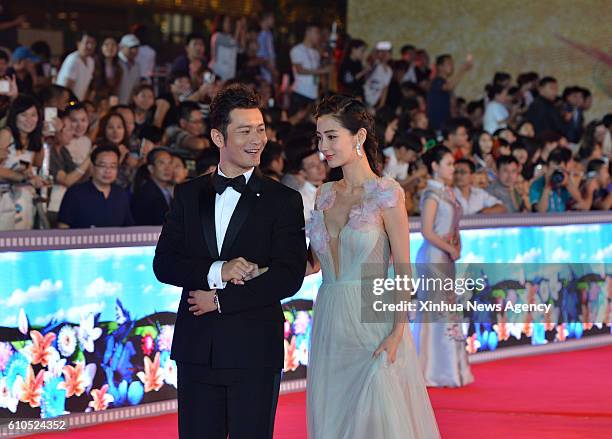 Sept. 25, 2016 -- Actor Huang Xiaoming and his wife Angelababay attend the red carpet event before the awarding ceremony of the 25th China Golden...