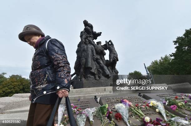 Raisa Maistrenko reacts during a visit to the Babi Yar monument in Kiev on September 23, 2016 a few days before Ukraine marks the 75th anniversary of...