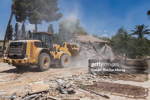 bulldozer demolishing house - bulldozer house stock pictures, royalty-free photos & images