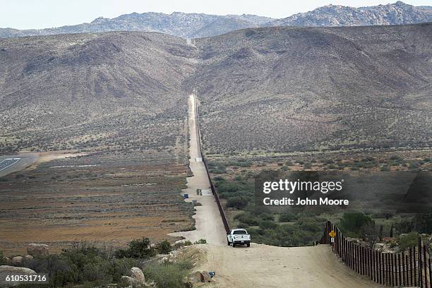 Border Patrol vehicle stands guard along the U.S.-Mexico border fence on September 26, 2016 in Jacamba Hot Springs, California.