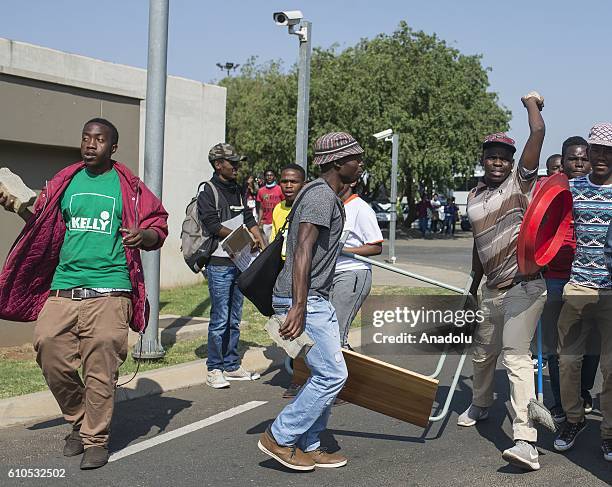 Students gather to protest after South African Minister of Higher Education and Training Blade Nzimande's explanations on possibility of raising...