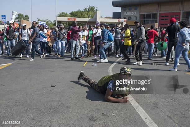 Students gather to protest after South African Minister of Higher Education and Training Blade Nzimande's explanations on possibility of raising...