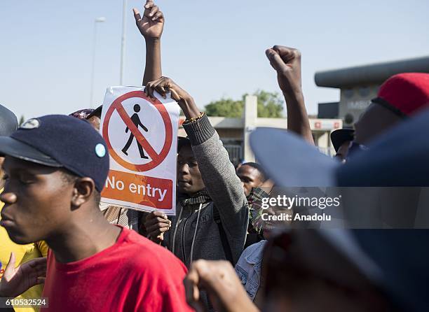 Students gather to protest after South African Minister of Higher Education and Training Blade Nzimande's explanations on possibility of raising...