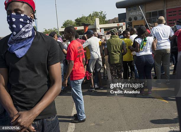 Students gather to protest after South African Minister of Higher Education and Training Blade Nzimande's explanations on possibility of raising...