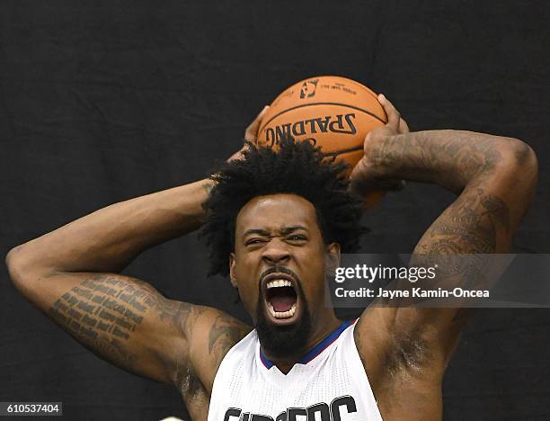 DeAndre Jordan of the Los Angeles Clippers films B roll for Fox Sports during media day at the Los Angeles Clippers Training Center on September 26,...