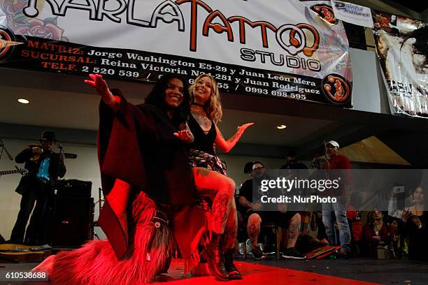 Megan Massacre, renowned American tattoo artist, dancing with a group of Ecuadorian dance at the tattoo convention &quot;Mitad del Mundo&quot; in...