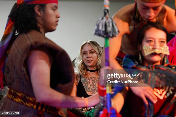Megan Massacre, renowned American tattoo artist, dancing with a group of Ecuadorian dance at the tattoo convention &quot;Mitad del Mundo&quot; in...
